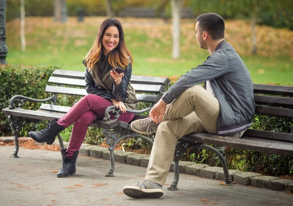 Two people in a quiet space, connected to other human listeners through their mobile devices, demonstrating that anonymous support can effectively bridge the gap of loneliness.